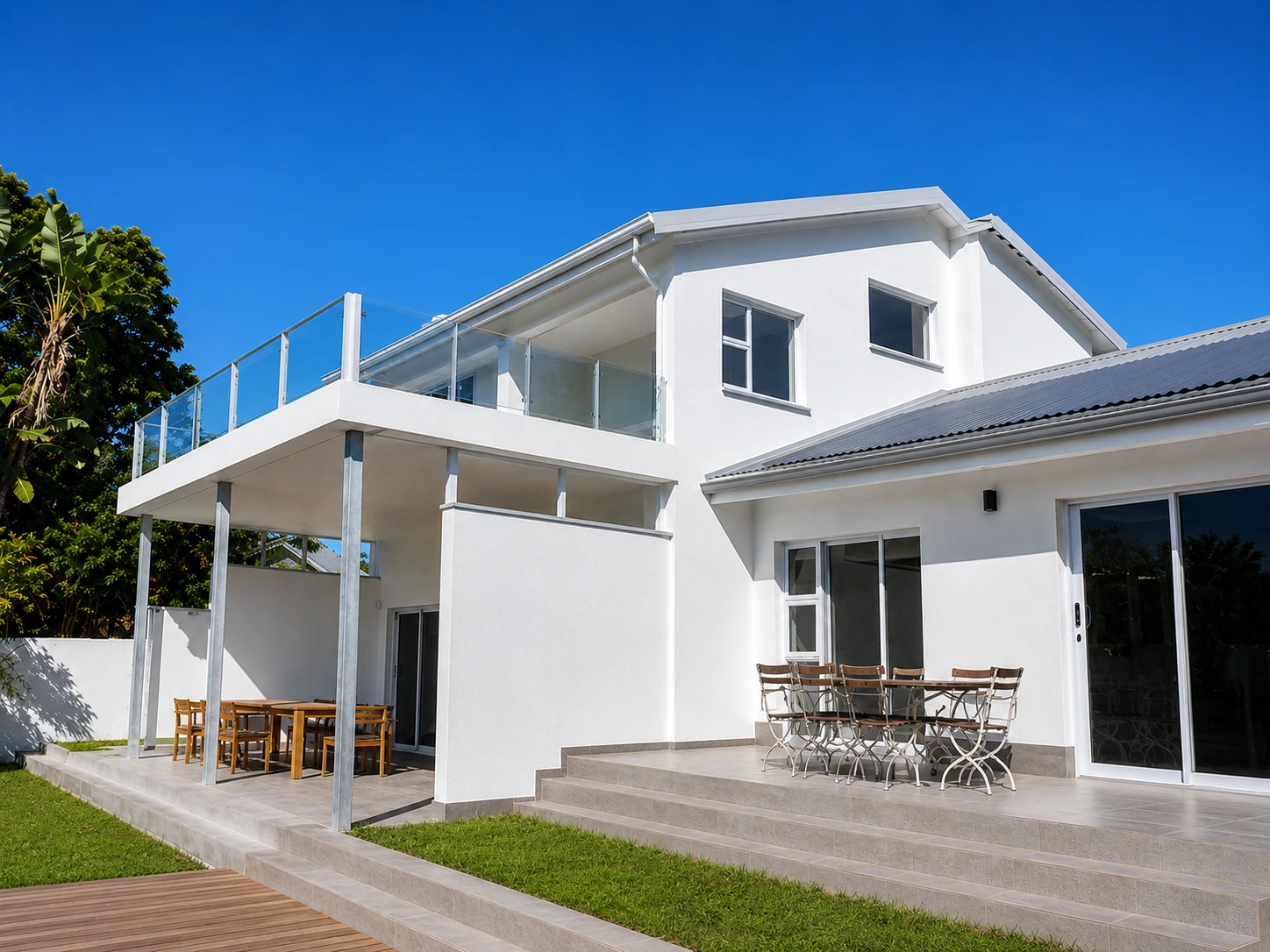 Gutters and downpipes on a Southbroom home with a patio and balcony