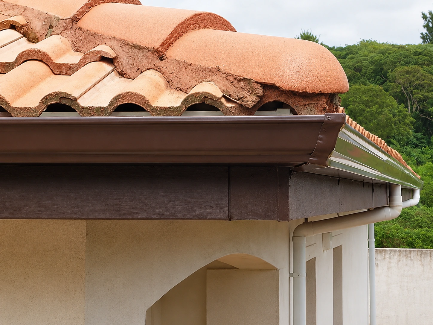 Gutter and fascia detail along a tiled roof edge